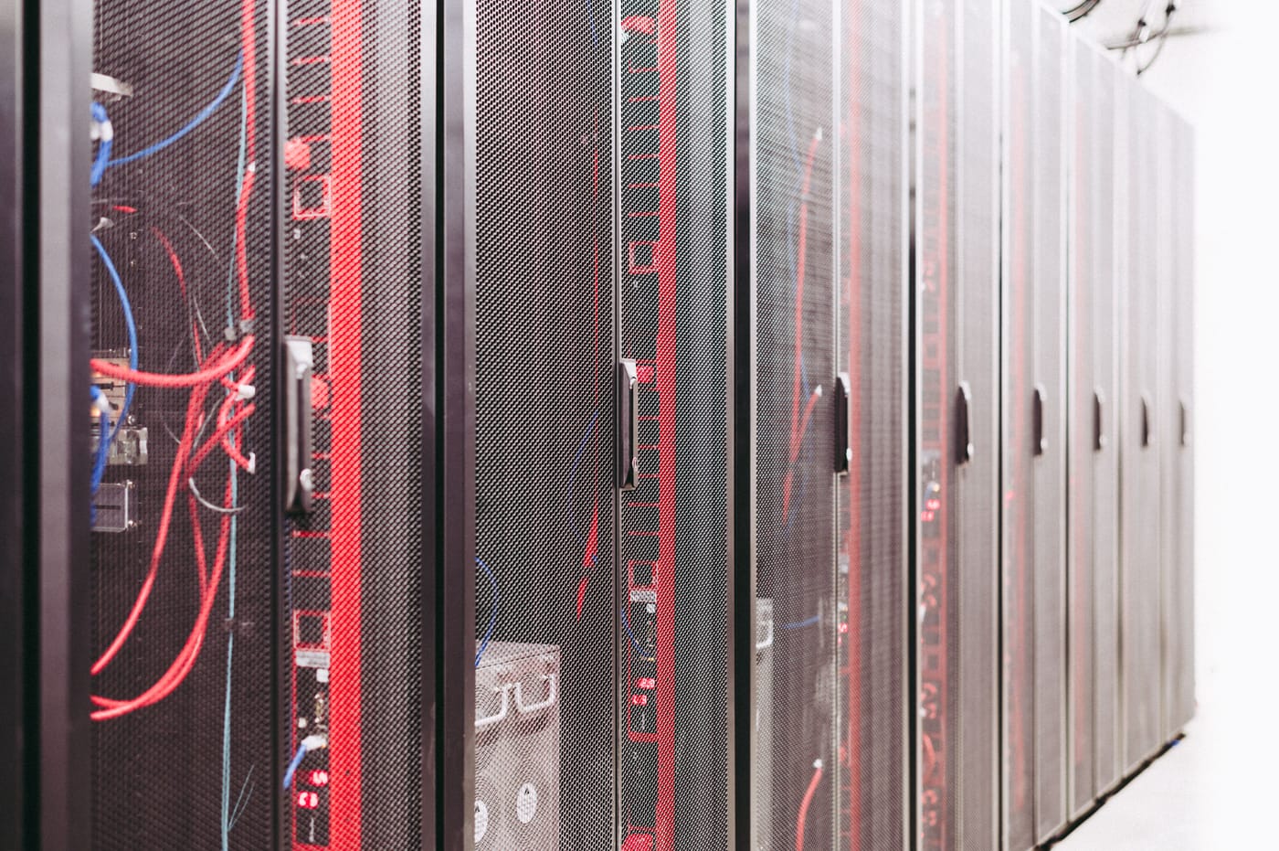 Row of network server racks and structured cabling serving businesses across the Las Vegas valley